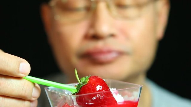 Thai Man Eating Pudding, Close Up In Studio