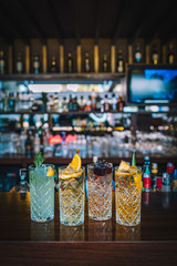 Colorful alcoholic drink cocktails on the bar table