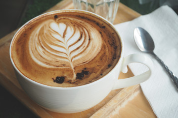 latte art coffee on hand for healthy drinking 