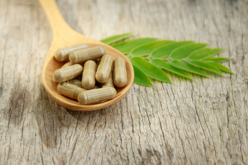 Alternative herbal medicine on wooden table for healthy eating 