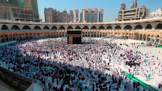 MECCA, SAUDI ARABIA - MAY 15, 2017: Video of unidentified pilgrims perform Tawaf around Kaaba inside Masjidil Haram, Makkah. Selective focus and crop fragment