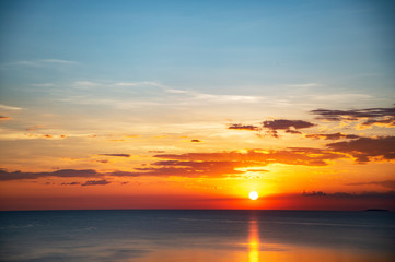 Naklejka na ściany i meble summer light cloudy blue sky at sunset on the sea coast for travel and vacation background