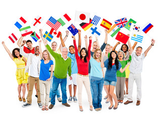 Obraz premium Cheerful Multi-Ethnic Group Of People Standing With Their Arms Raised Holding World Flags.