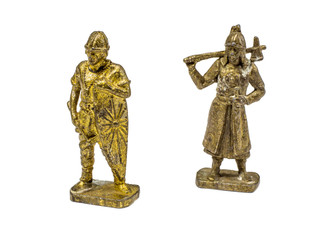 two metal figurines of a warrior.
