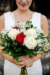 Obraz na płótnie Canvas Bride with a bouquet of roses