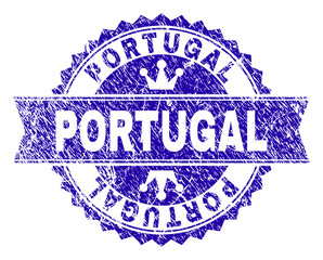 PORTUGAL rosette seal watermark with grunge texture. Designed with round rosette, ribbon and small crowns. Blue vector rubber watermark of PORTUGAL text with scratched texture.