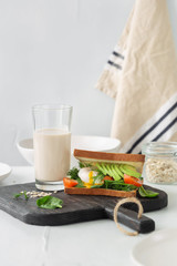 Healthy breakfast oat milk Brunch breakfast Sandwich poached eggs avocados
