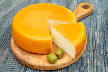 Fresh, round cheese.