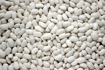 Lots of white large beans, top view, background. Legumes.