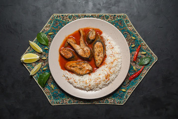 Indian red curry dish. Fish in spicy red curry. 