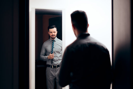 Handsome Elegant Man Looking in the Mirror