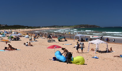 Sydney, Australia - Feb 3, 2019. People relaxing at the beach on a hot sunday in summer time. Dee Why beach, Sydney, NSW, Australia.
