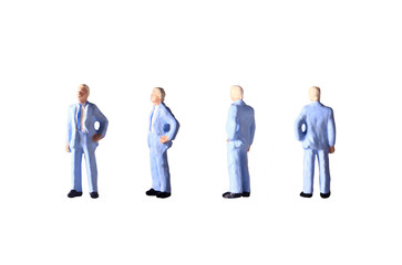 Photo Miniature Figure toy Black Tuxedo Businessman explaining someting isolated on white for compositing use isolated on white