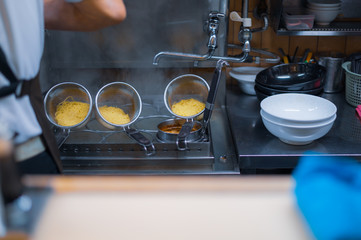 closeup of dental equipment chef cooking ramen Japanese food.