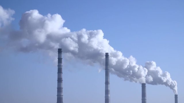 Smoke from the chimneys plant rises into the clouds 003