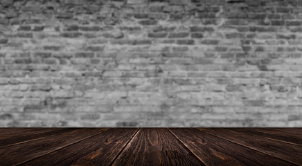 background of an empty white room, a cellar, lit by a searchlight. Brick white wall and wooden floor