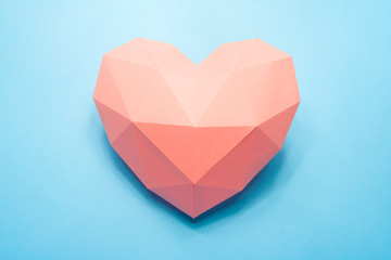 Paper hearth with shadow. Pink polygonal paper heart for