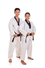 Martial arts couple standing pose and smile, studio background