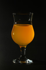 Orange drink in a cocktail glass