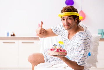 Young man celebrating his birthday in hospital