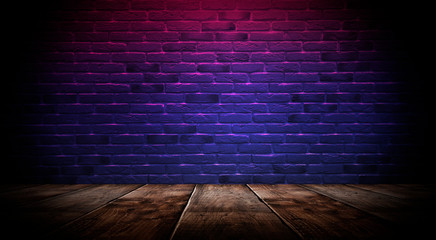 Illumination of an empty brick wall, neon light, smoke. The night scene of an empty room is decorated with abstract light. Night smoke.