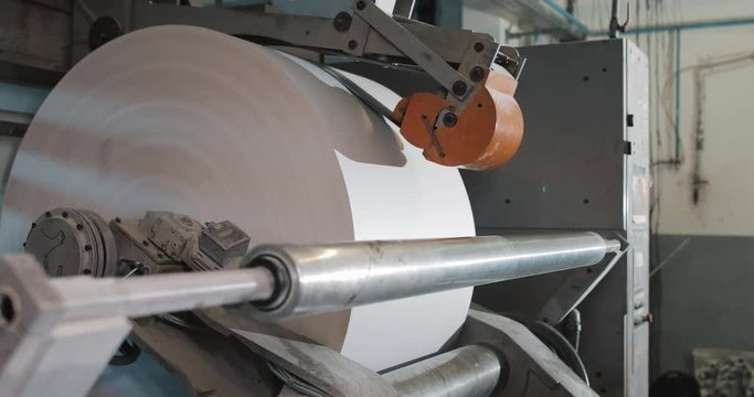 Rotation machine in printing house. Processing of secondary sources. Paper recycling. Large enterprise