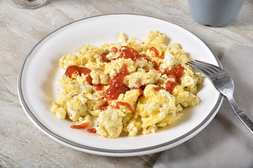 Scrambled egg breakfast with ketchup