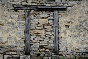 wooden beams in stone wall in abandoned house in the village of Arechavaleta (Alava) Basque Country, Spain