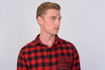 Obraz premium Young handsome hipster man with blond hair thinking