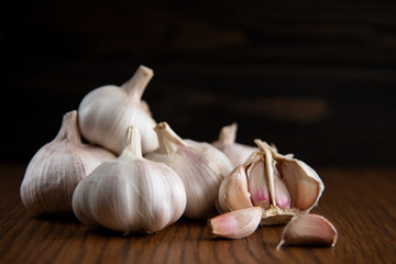Garlic bulb on the wooden vintage background