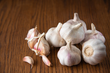 Garlic bulb on the wooden vintage background