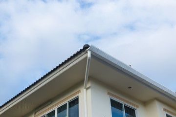 roof gutter on residential house building