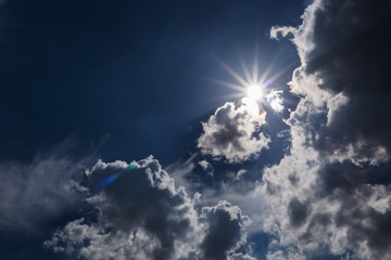 sun on dramatic moody sky