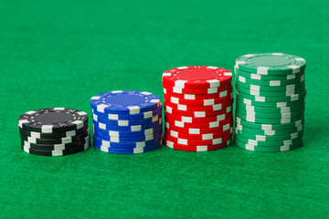 Casino chips on green table