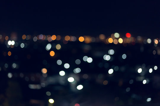 colorful night light in the city, image blur nightlife background © sutichak