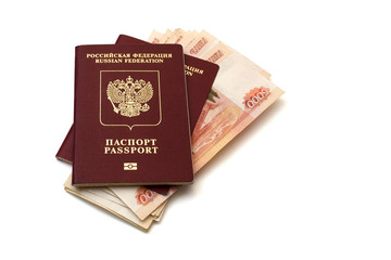 Isolated Russian passports and a pack of five thousandth ruble banknotes on white background