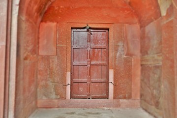 old wooden door in brick wall