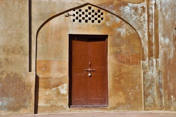 old wooden door in the wall
