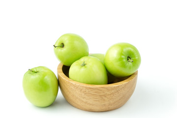 apple monkey or jujub (Zizyphus mauritiana Lam) isolated green fruit in wooden cup on white background and clipping path.