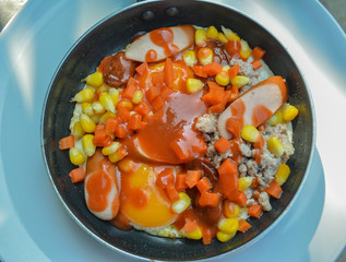 Pan fired egg with toppings for breakfast or dinner homemade food for Thai people in Thailand