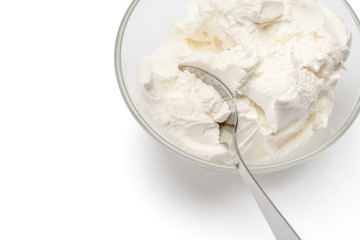 Traditional Mascarpone cheese in glass bowl isolated on white with clipping path