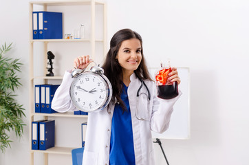 Female doctor in blood transfusion concept