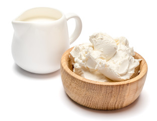 Traditional Mascarpone cheese and cream or milk isolated with clipping path
