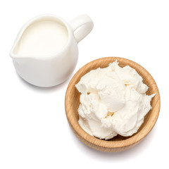 Traditional Mascarpone cheese and cream or milk isolated with clipping path