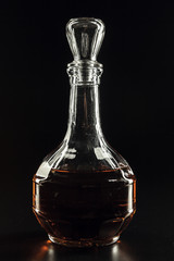 bottle of whiskey, or rum, or alcohol stands