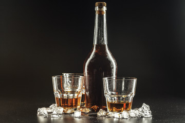 Glass of the whiskey and a square decanter