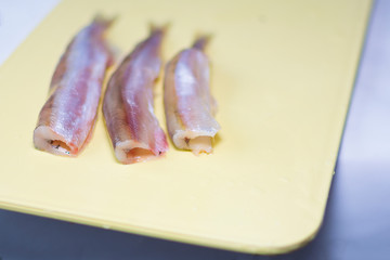 Fresh fish fillet on the cutting board for cooking delicious dishes. Concept: healthy food, home cooking, fishing.