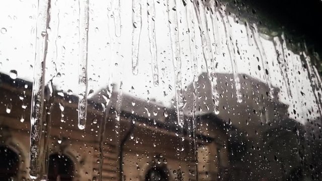 Footage of some icicles and drops of water on a winter day.