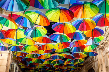 Fototapeta na wymiar Decorative umbrellas in the streets of Bucharest, Romania