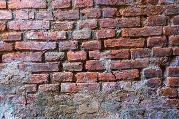 Cracked concrete vintage wall background, old brick wall